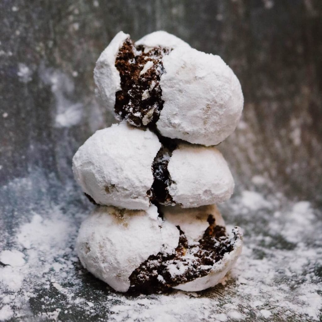A stack of Hercules brownie bites dusted in icing sugar