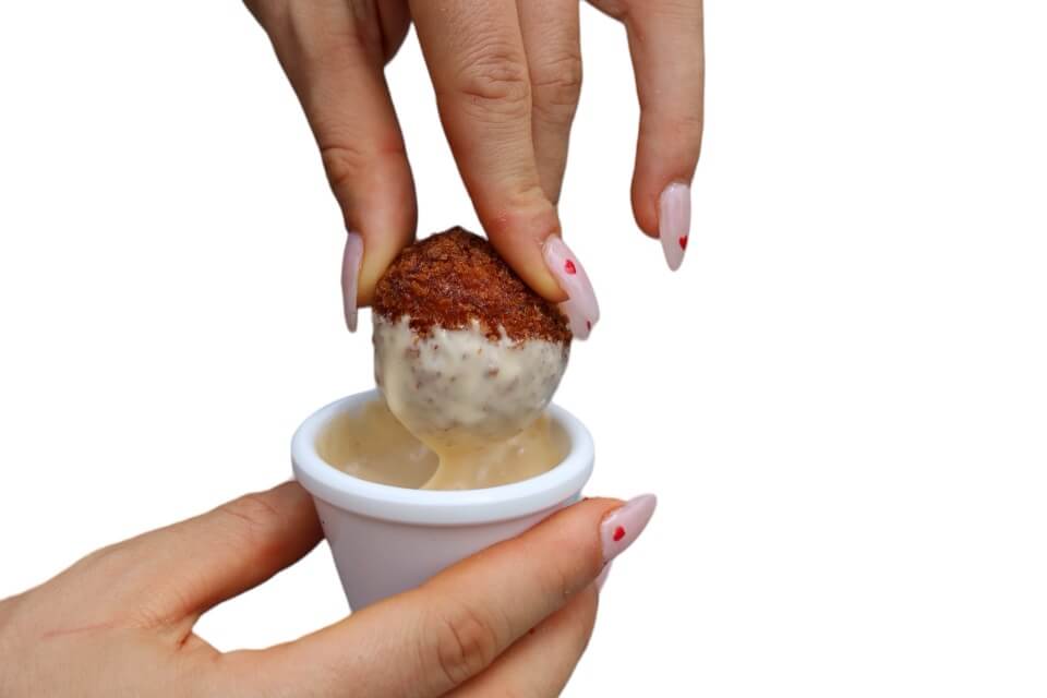 Arancini dipped in aioli