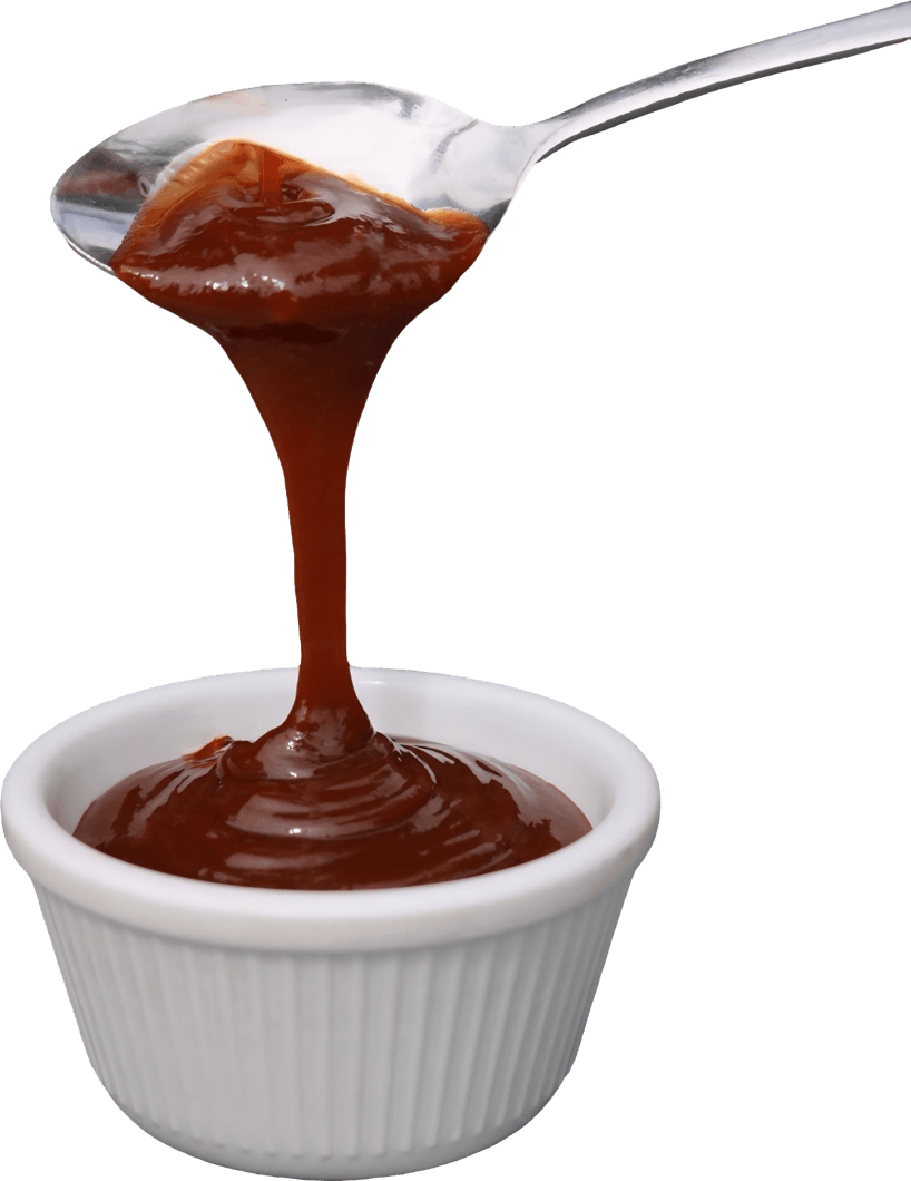 Smoky BBQ sauce poured from a spoon